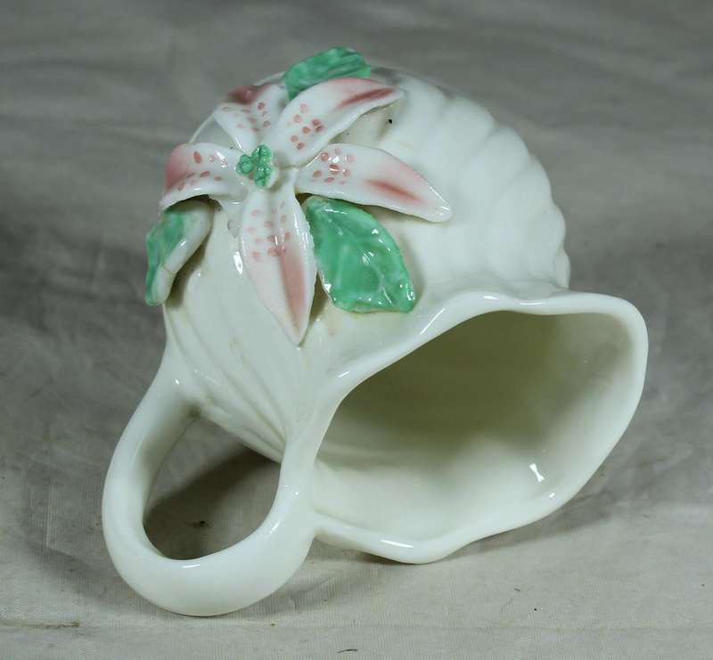 Small milk jug with embossed orchid flower