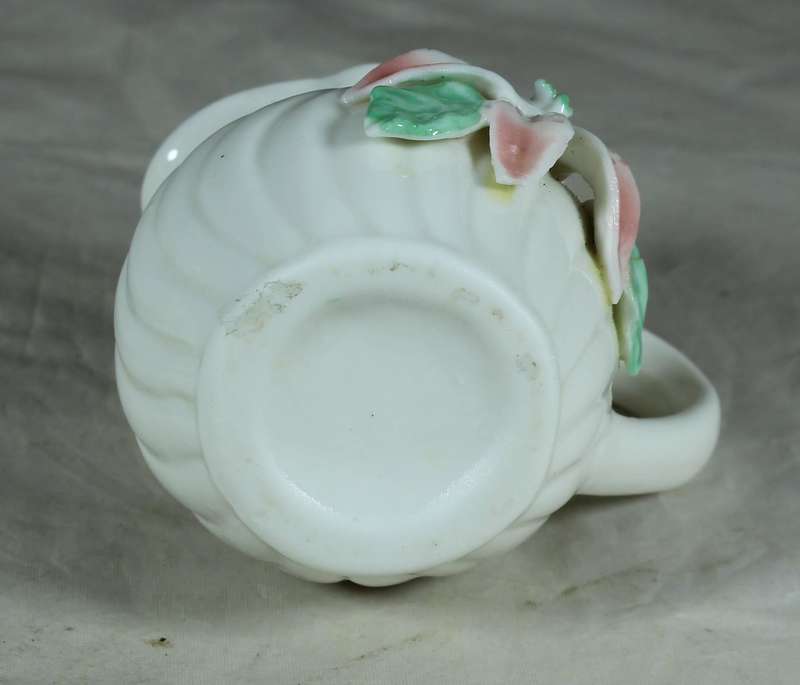Small milk jug with embossed orchid flower