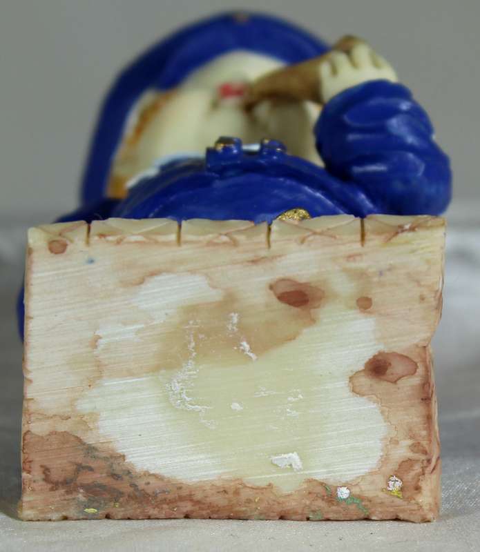 Boy sailor figure smoking a pipe