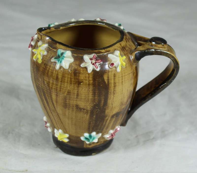Small Italian milk jug with embossed flowers