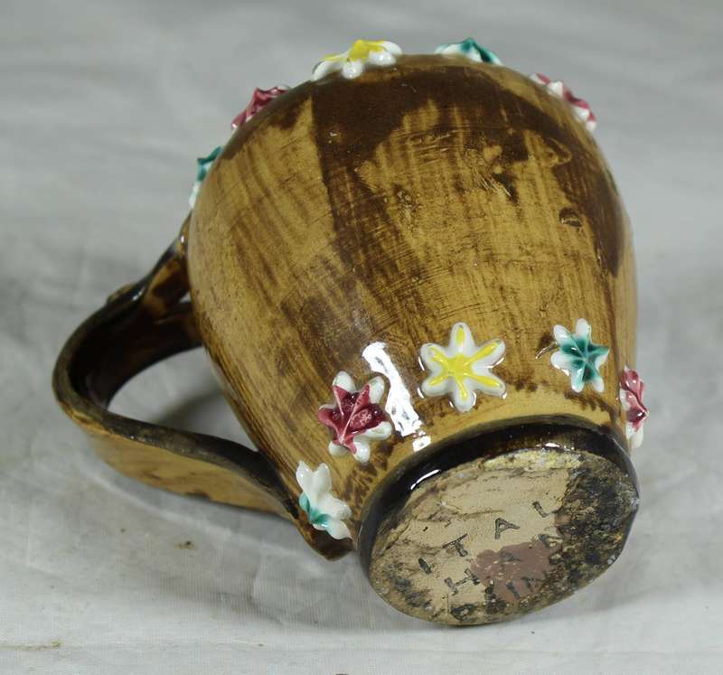 Small Italian milk jug with embossed flowers