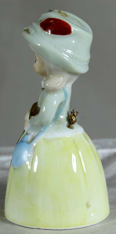 Porcelain lady with a cane - bell