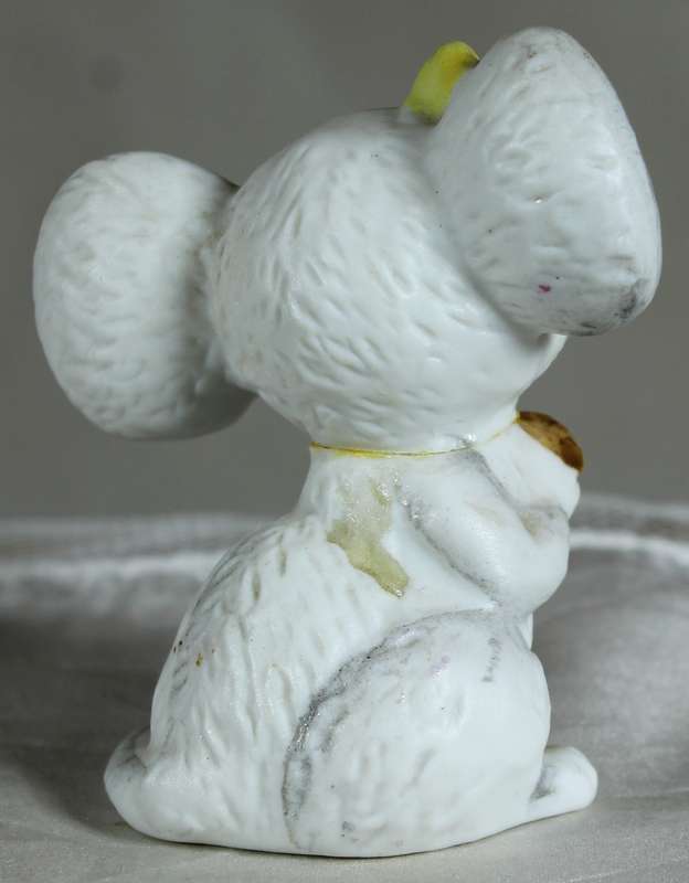 Mouse holding a mushroom