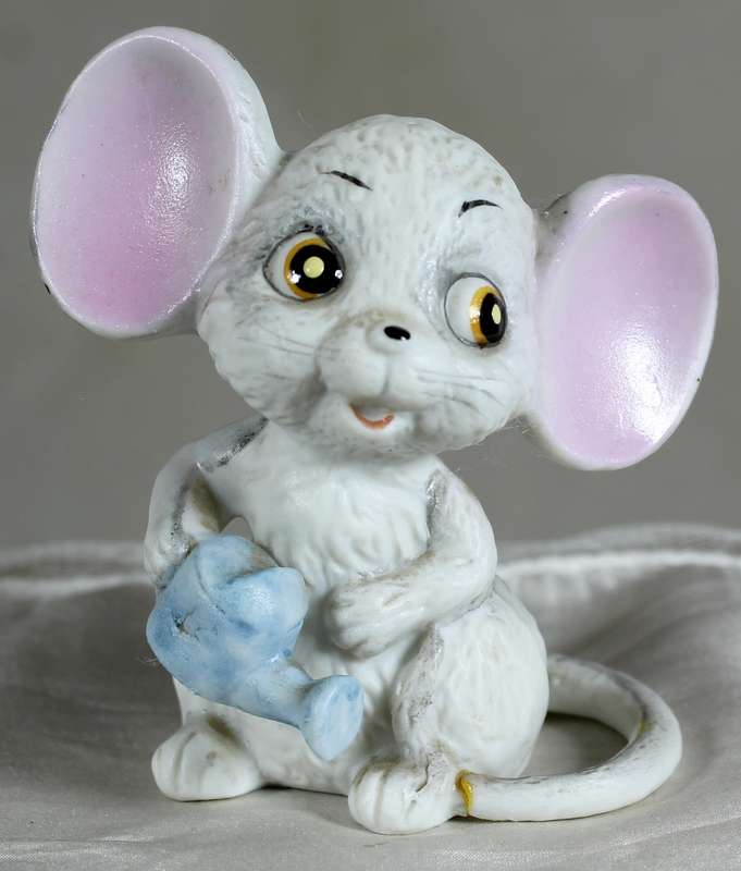 Mouse with a watering can