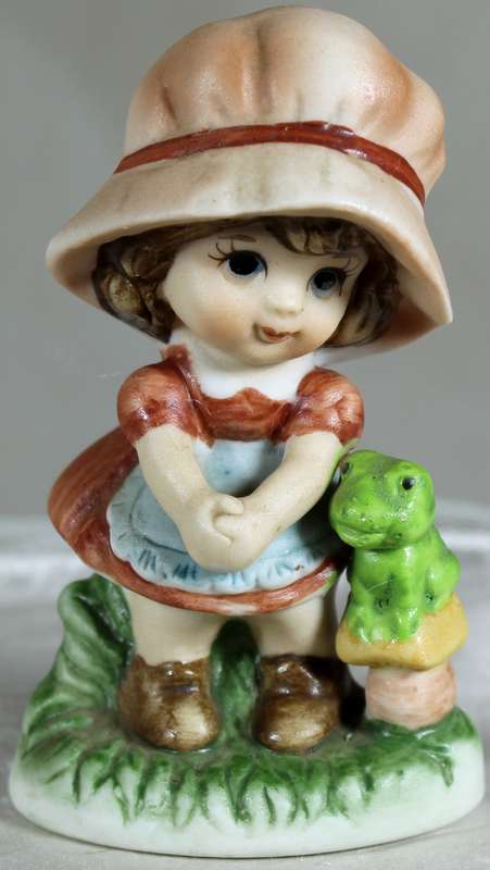 Little girl with a frog
