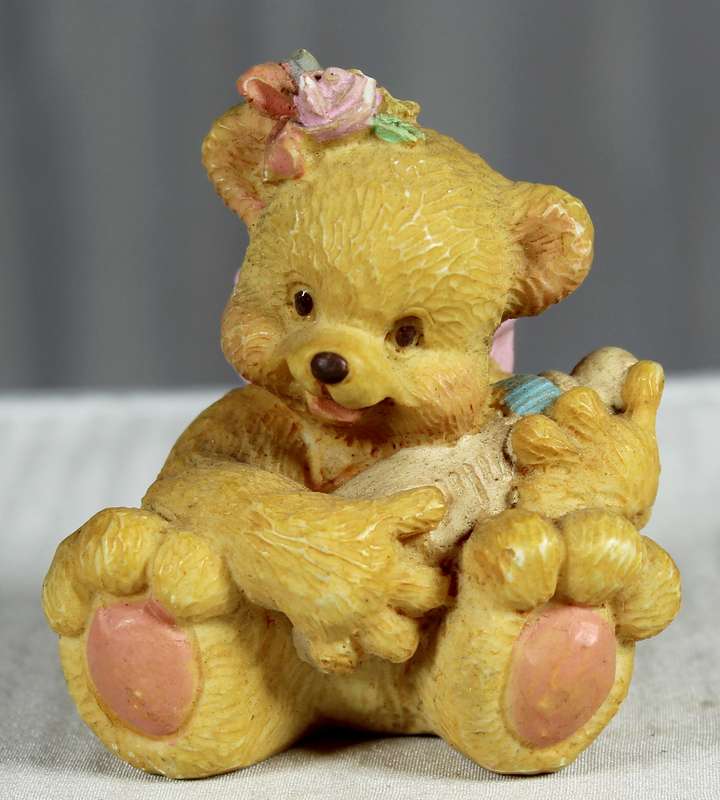 Baby girl bear  with flowers in hair