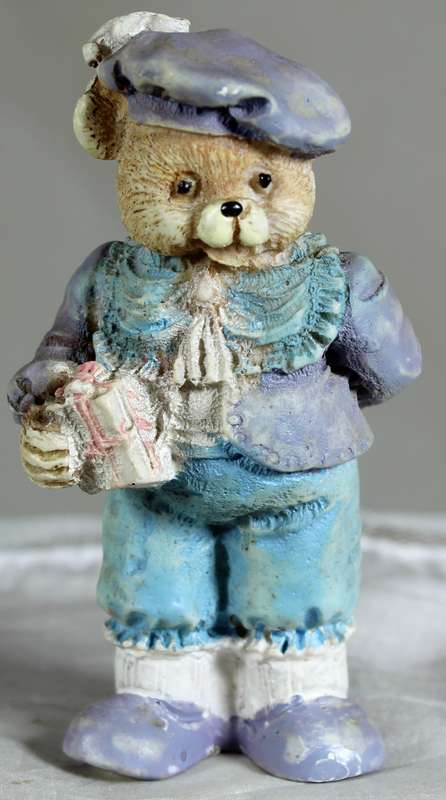 Brother bear holding a gift