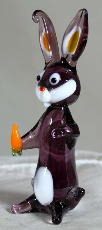 Glass rabbit holding a carrot