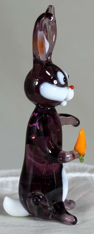 Glass rabbit holding a carrot