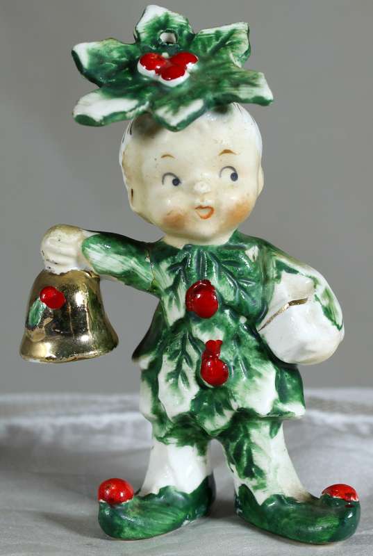 Little boy dressed in leaves and berry's