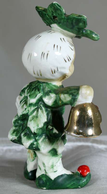 Little boy dressed in leaves and berry's