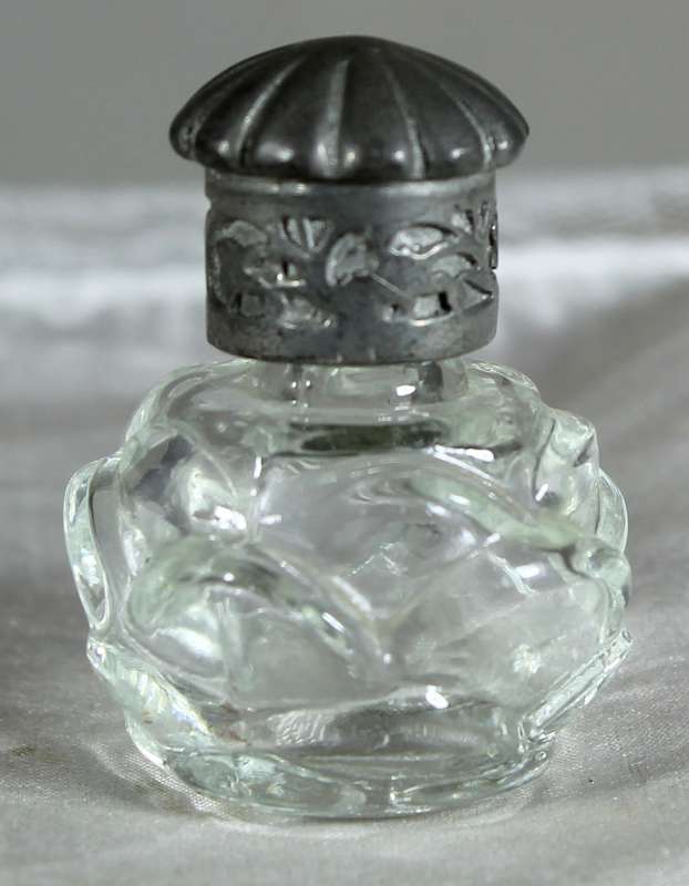 Miniature perfume bottle with metal top