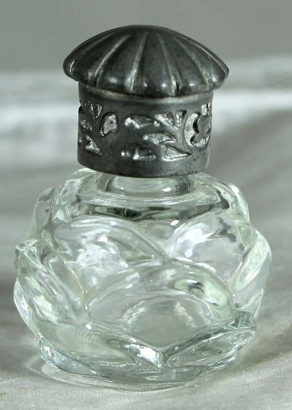 Miniature perfume bottle with metal top