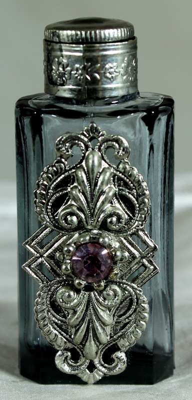 Small perfume bottle with metal and diamante embellishment