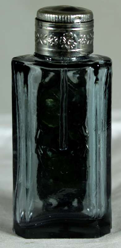 Small perfume bottle with metal and diamante embellishment