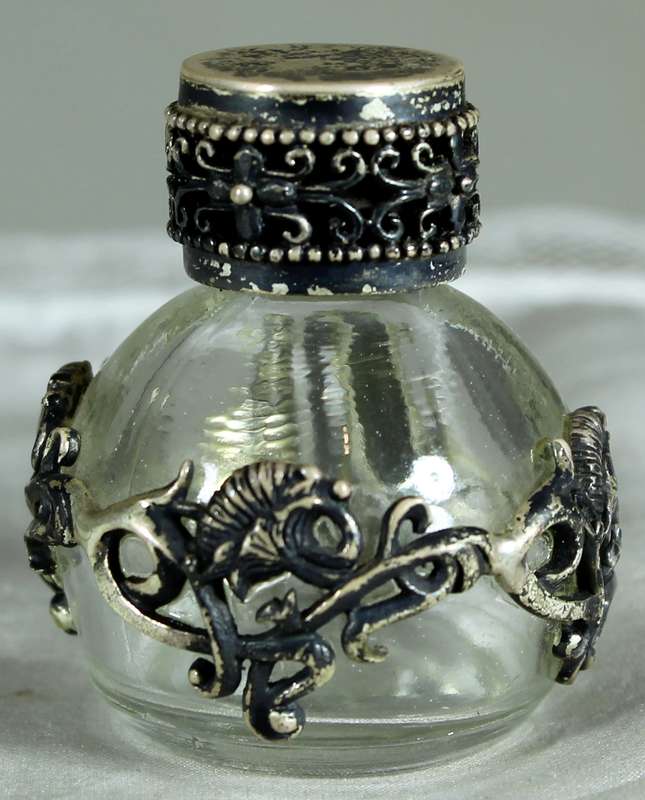 Miniature perfume bottle with metal embellishment