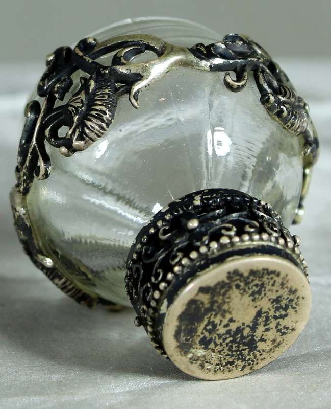 Miniature perfume bottle with metal embellishment