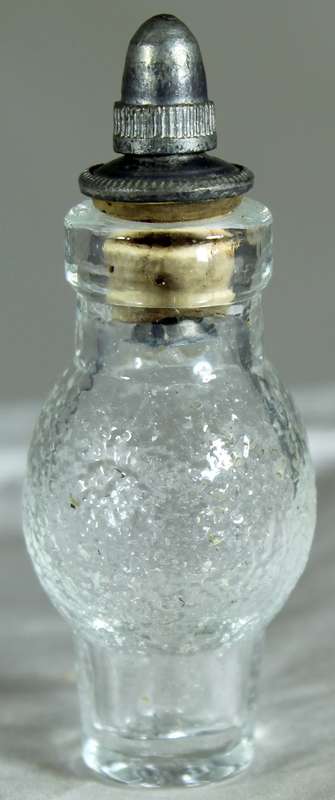 Miniature perfume bottle with metal top