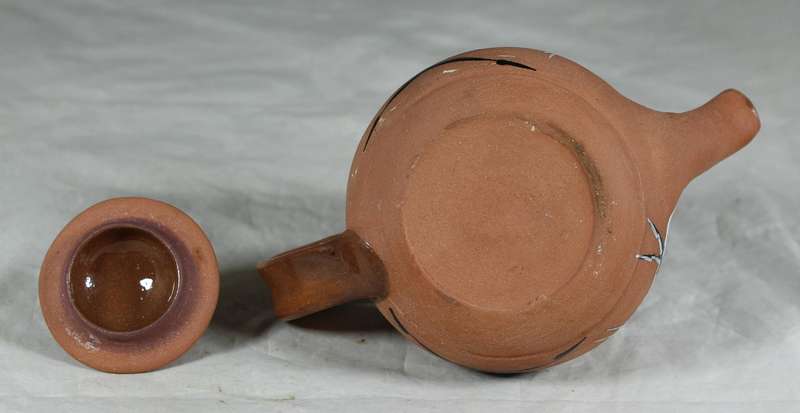 Small pottery kettle with painted figures