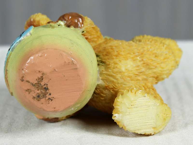 Bear with face in honey pot