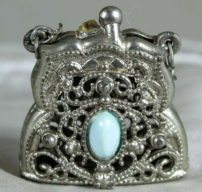 Engraved metal locket with semi-precious stones