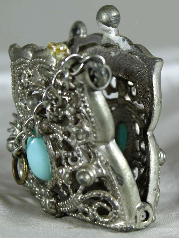 Engraved metal locket with semi-precious stones