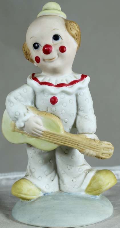 Clown playing a guitar