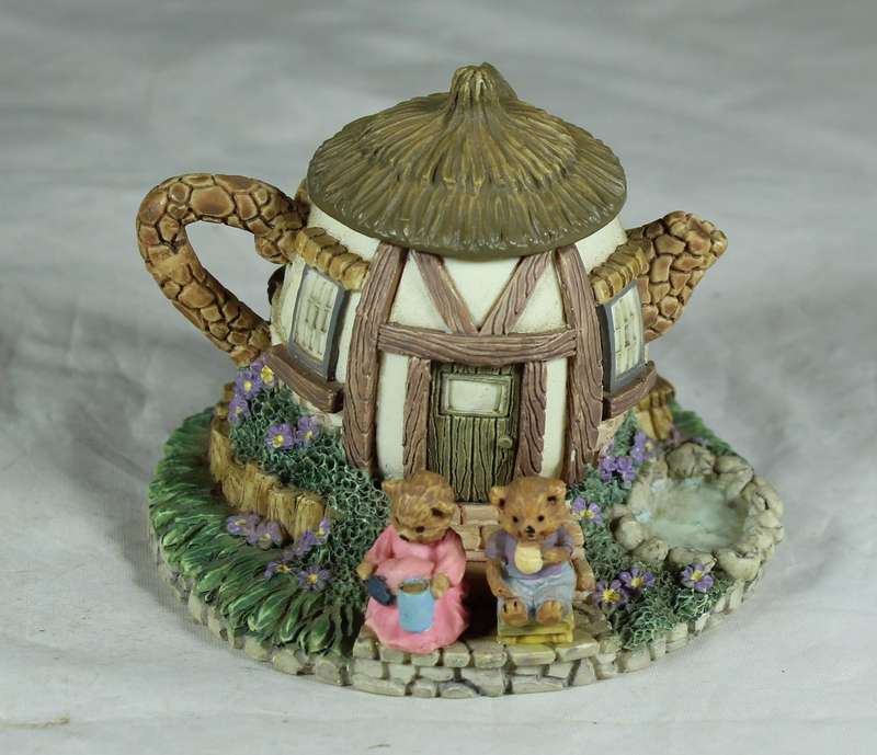 Ornamental tea kettle with a bears house
