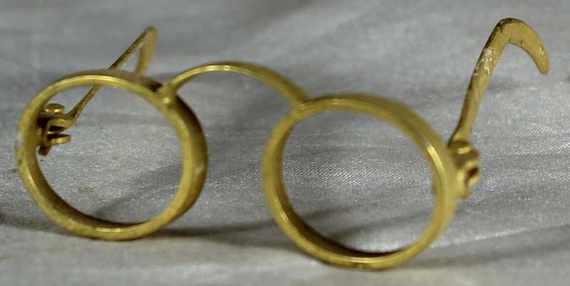 Miniature brass glasses