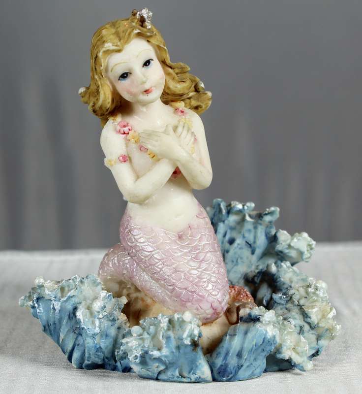 Mermaid figurine on a shell