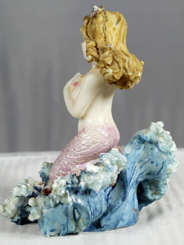 Mermaid figurine on a shell
