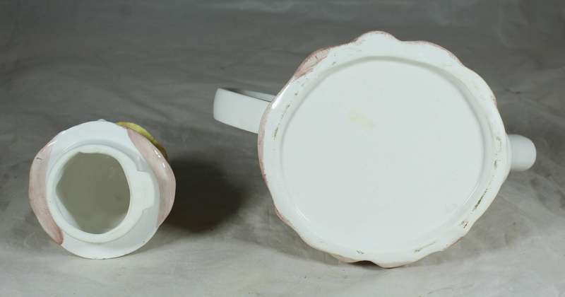 Ornamental porcelain kettle in the shape of an old woman