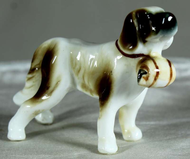 Miniature porcelain dog with barrel