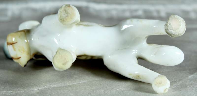 Miniature porcelain dog with barrel