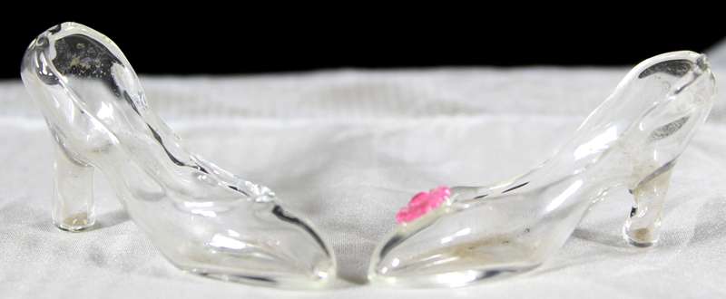 Miniature glass pair of odd high heel shoes