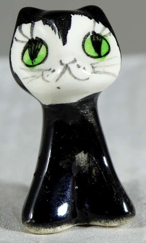 Miniature kitty with big eyes