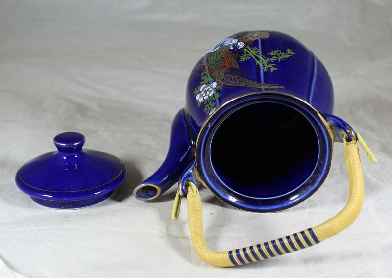 Ornamental porcelain kettle with Oriental motif