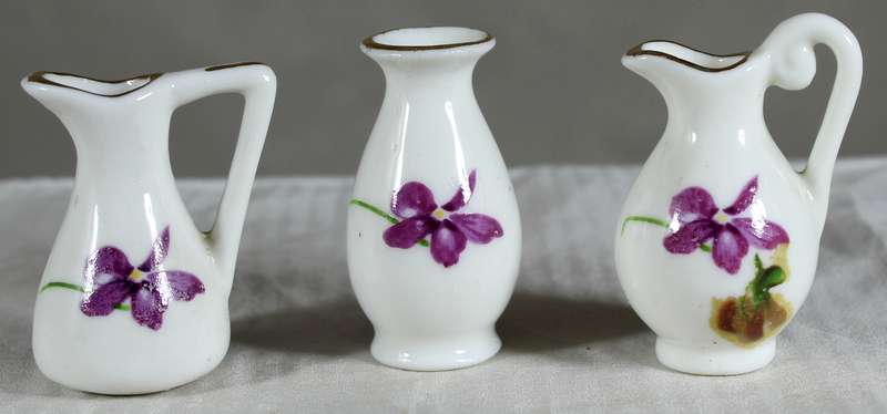 Miniature trio of jugs and posy vase