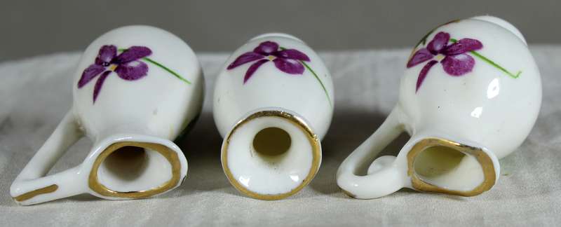 Miniature trio of jugs and posy vase