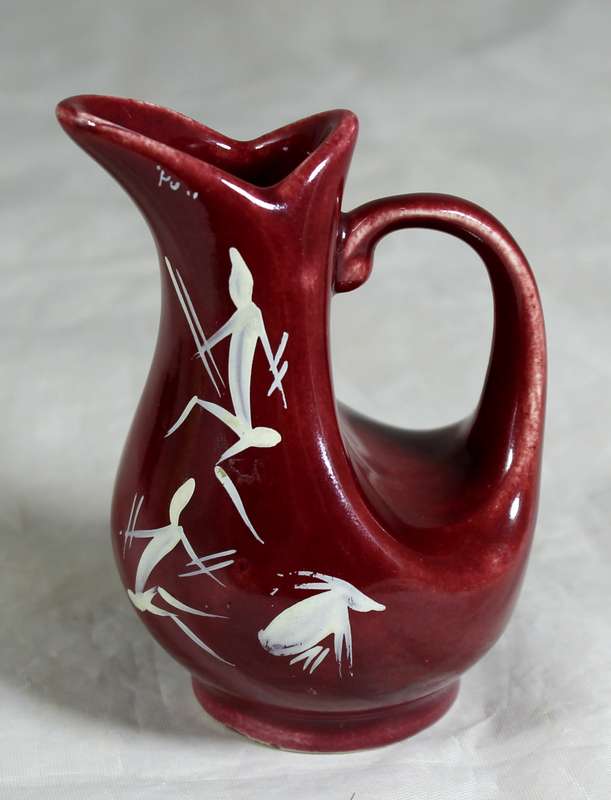Small burgundy jug with rock art