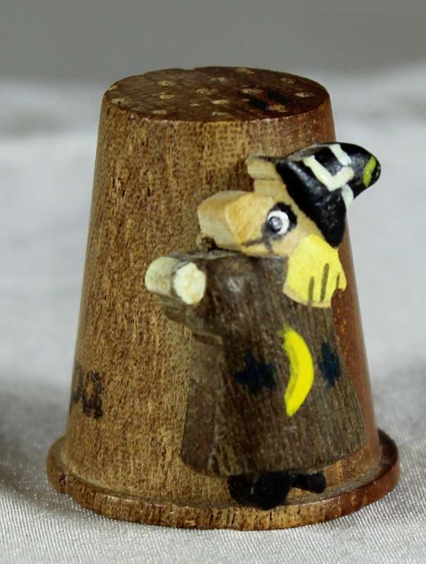 Wood thimble with witches figurine