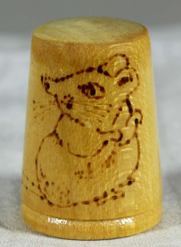 Wood thimble with mouse drawing