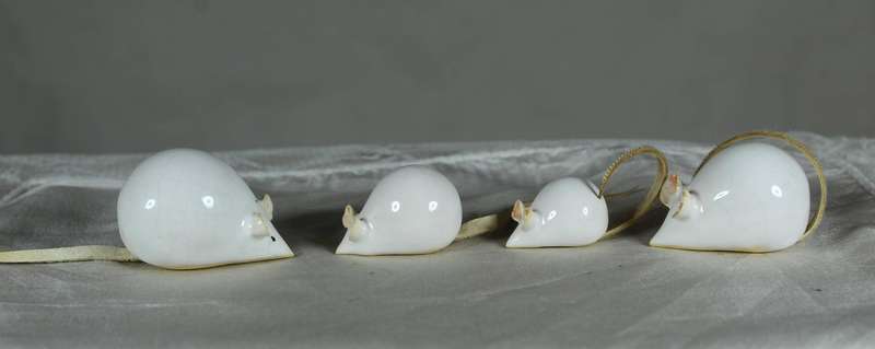 Miniature family of mice with leather tails