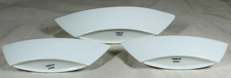 Graduated boat shaped serving bowls