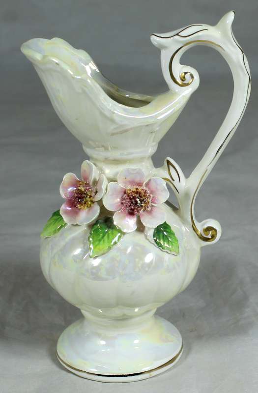 Ornate porcelain jug with flowers