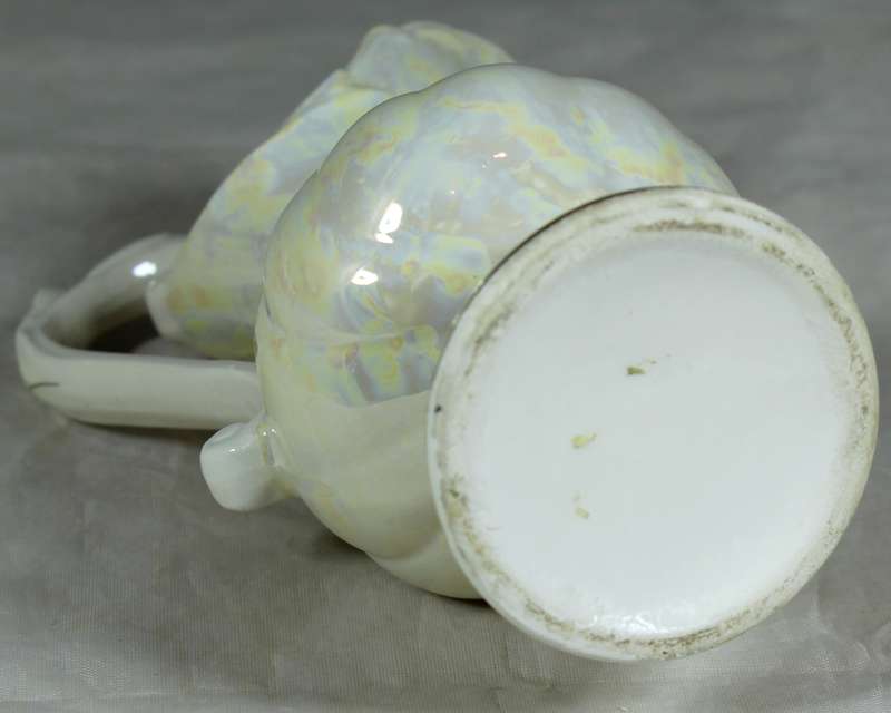 Ornate porcelain jug with flowers