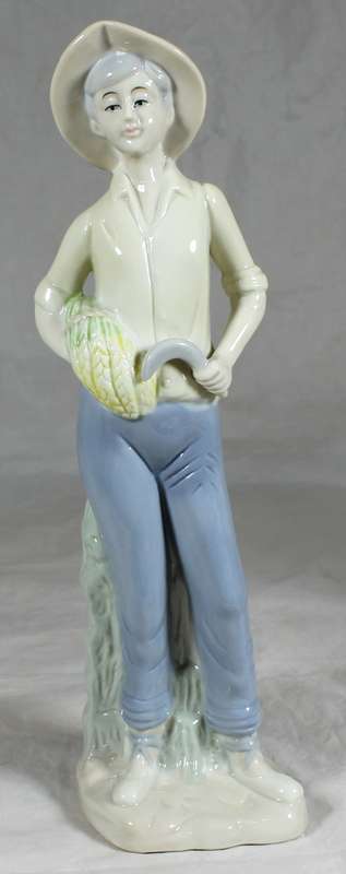 Porcelain farmer with picked wheat