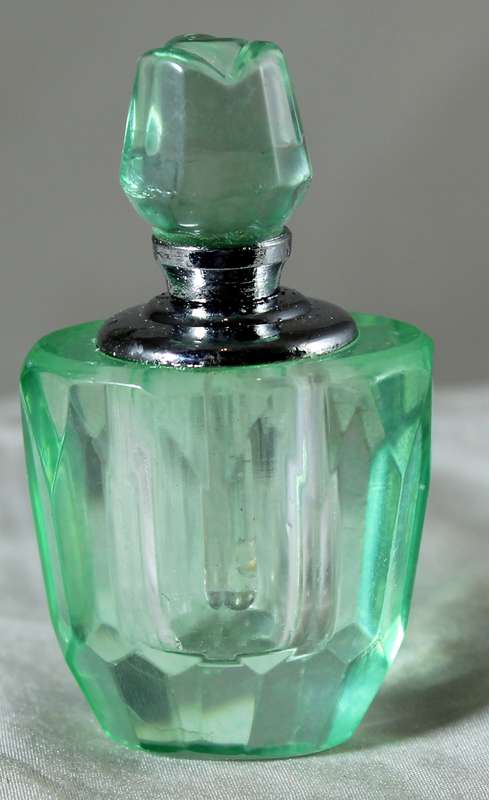 Miniature green glass perfume bottle