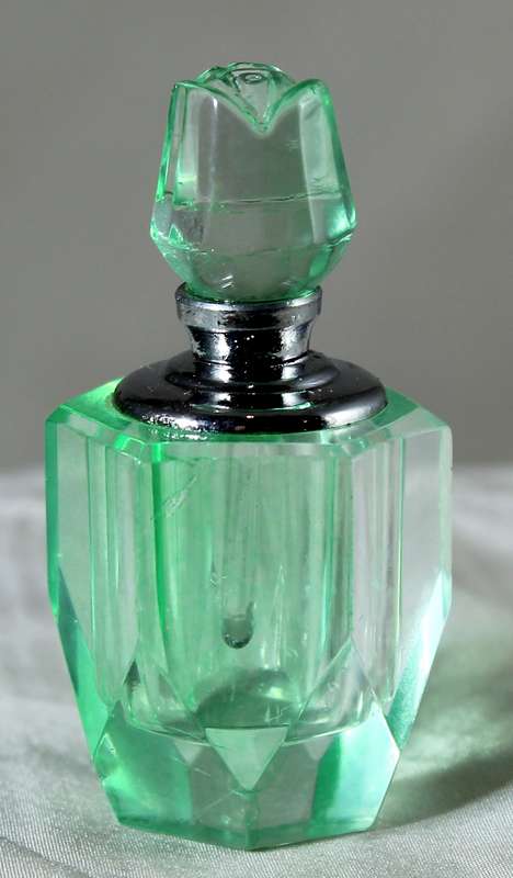 Miniature green glass perfume bottle