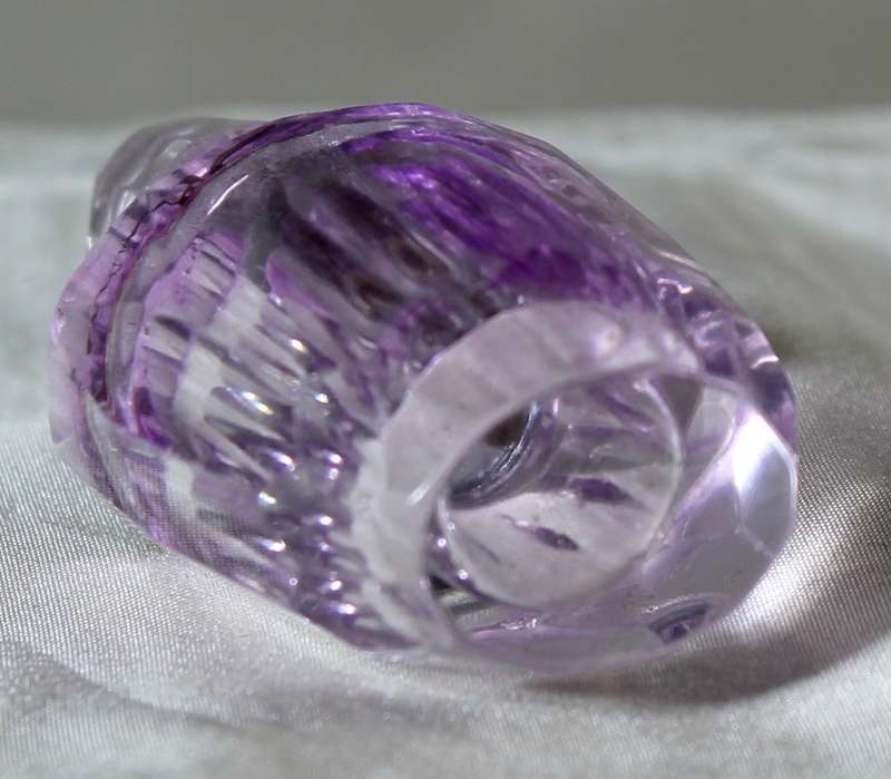 Miniature purple glass perfume bottle